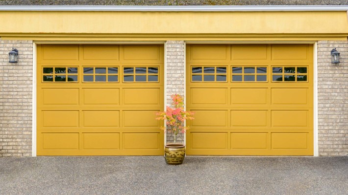 Custom-made garage doors with glass window panels.
